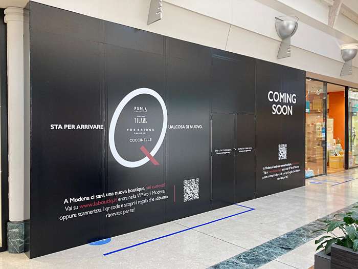 installazione adesivo cesata negozio
